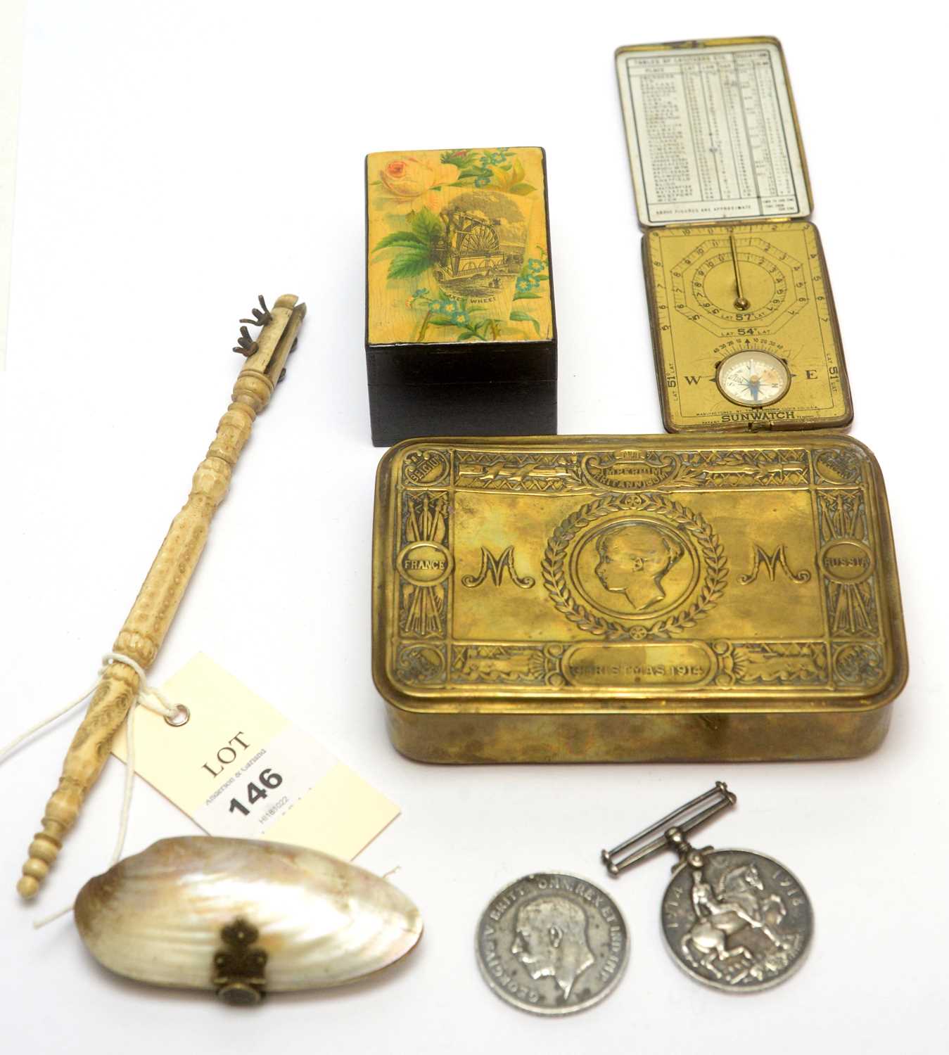 A selection of medals, compass and other items