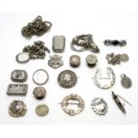 A selection of silver and other brooches, and other items