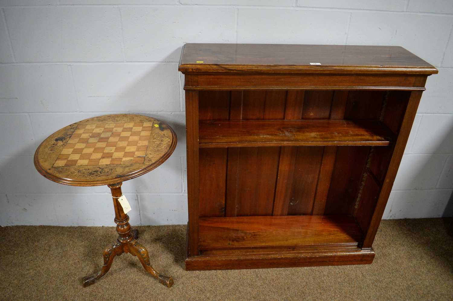 Early 20th C open bookcase; and a Victorian tripod games table.