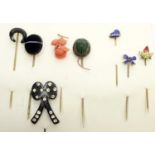 A collection of tie pins,