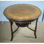 An Edwardian inlaid mahogany centre table.