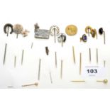 A collection of tie pins,