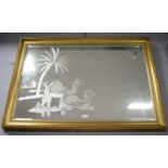 A decorative gold framed and bevelled wall mirror.