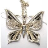Thomas Sabo: a silver and black stone set butterfly pendant,