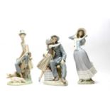 A collection of three Lladro figures