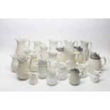 A selection of late 19th C Staffordshire pale-buff stoneware jugs; and others.