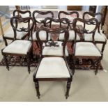 A set of eight early Victorian mahogany balloon back dining chairs.