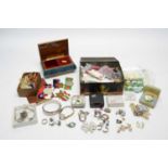 An assortment of costume jewellery and WWII medals