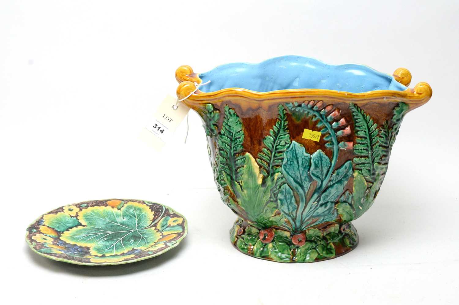 A Majolica planter; and a Majolica leaf plate,