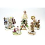 A Continental ‘Naples’ style porcelain figural vase; and Capodimonte and other figures