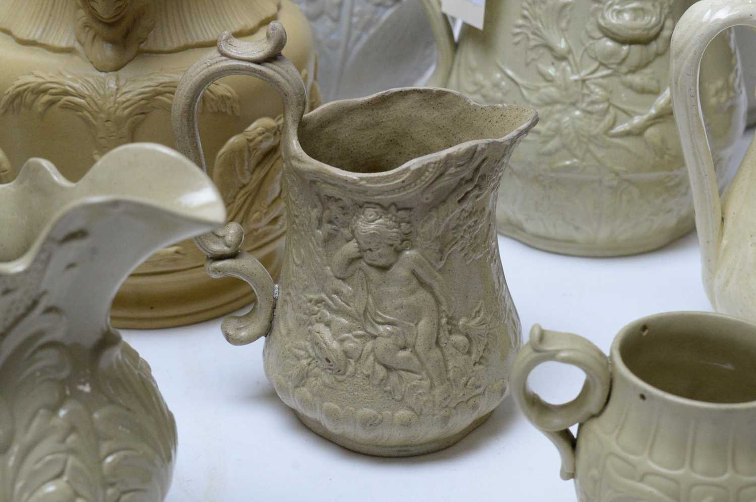 A selection of Dudson and Ridgway buff-coloured moulded stoneware jugs. - Image 3 of 5