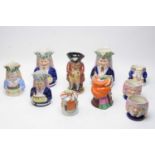 A selection of Staffordshire toby jugs; and other items.