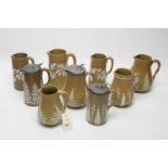Late 19th C Ridgway chocolate and buff-coloured sprigged stoneware jugs, various.