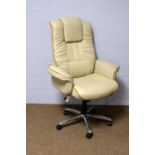 A cream leather executive office armchair.