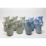A selection of Dudson pale-green and pale-blue moulded stoneware jugs.