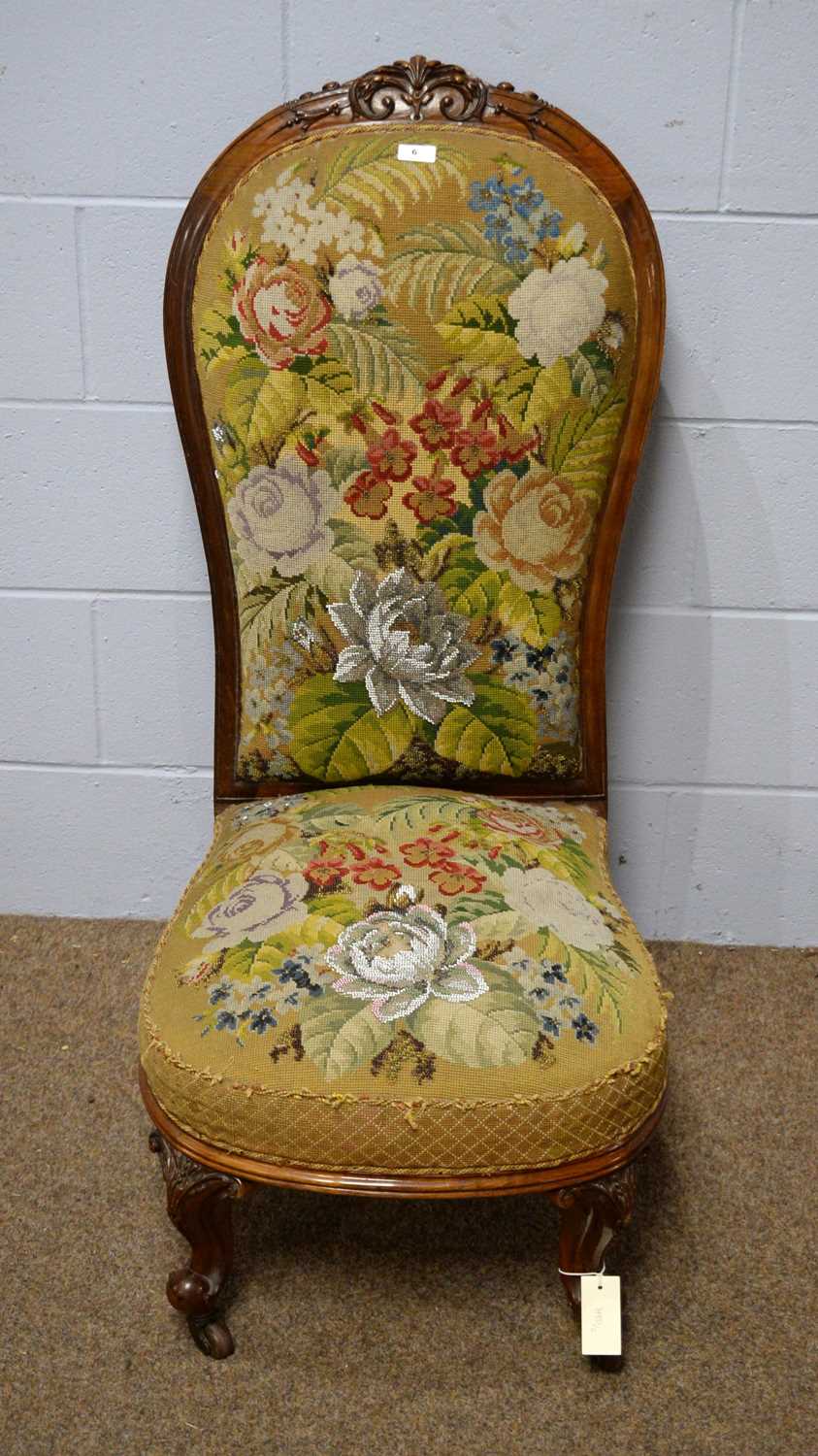 An attractive Victorian carved walnut easy chair.