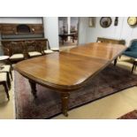 A substantial early Victorian mahogany wind-out extending dining table.