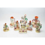 A small group of Staffordshire figures and spill vases.