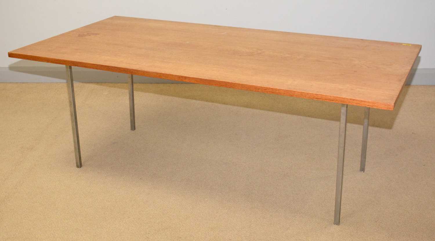 A mid-Century teak and brushed steel dining table.