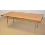 A mid-Century teak and brushed steel dining table.