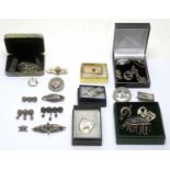 A collection of Edwardian silver brooches,
