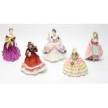 A collection of Royal Doulton ceramic figures.