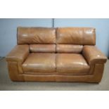 Land of Leather: a modern brown leather two-seater sofa.