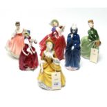 A collection of Royal Doulton figures of ladies