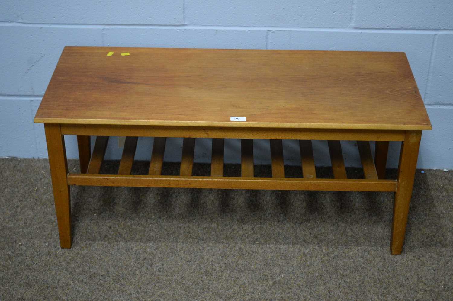 A mid Century teak coffee table.