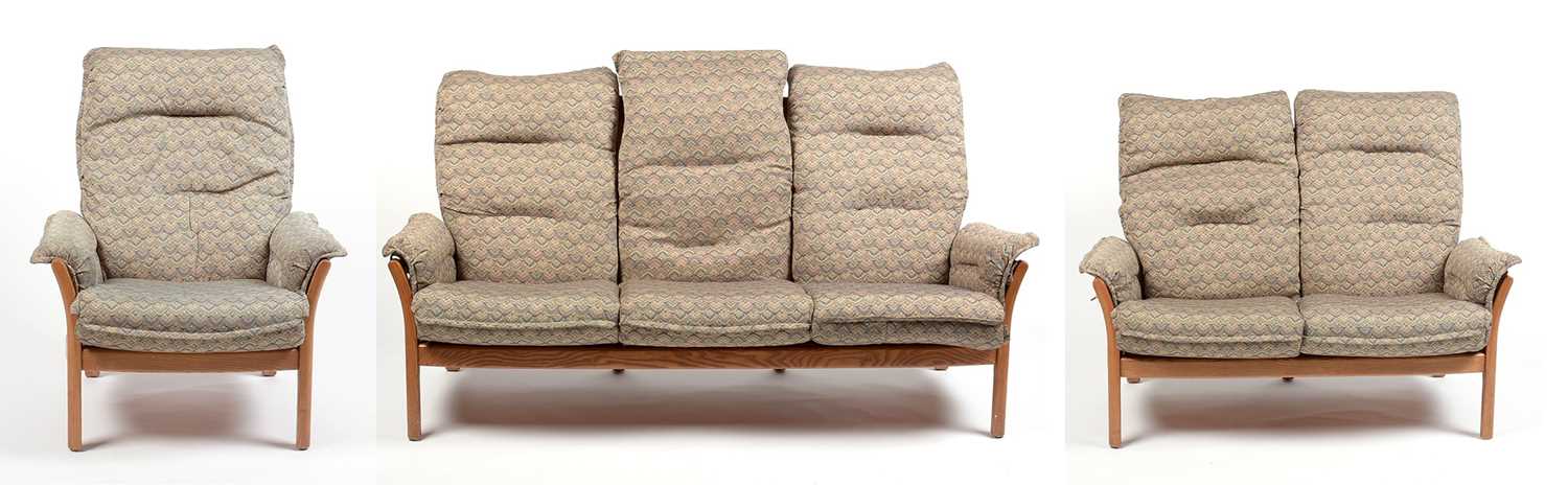 Ercol: an elm ‘Saville’ three-piece suite.