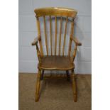 A Victorian style elm and beech Windsor style armchair