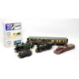 Boxed and loose 0-gauge railway locomotives and rolling stock