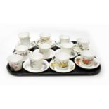 A set of German Berlin porcelain trembleuse coffee cups and saucers; and another
