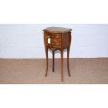 A Louis XV style walnut and banded serpentine fronted bedside chest.