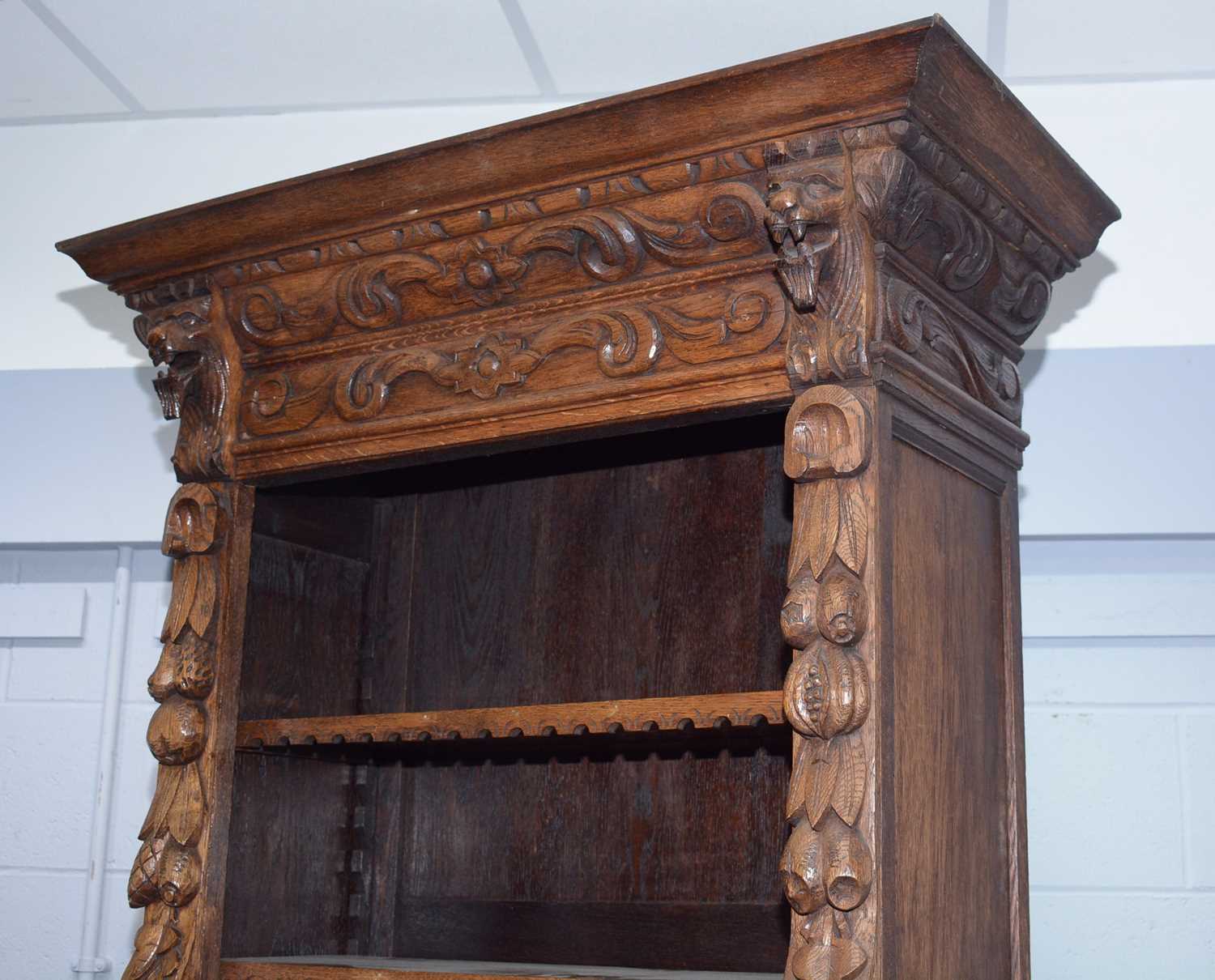 A profusely carved North European 19th C oak bookcase cabinet. - Image 4 of 12