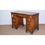 Reprodux/Bevan Funnel Ltd: a Georgian-style mahogany kneehole desk.