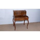 A late 19th Century French walnut bonheur du jour.