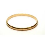 A 9ct yellow gold bamboo pattern bangle,