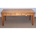 A vintage rustic pine kitchen table,