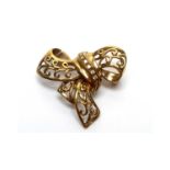 A diamond set 9ct yellow gold bow pattern brooch,