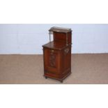 An Edwardian carved walnut and serpentine fronted coal purdonium.