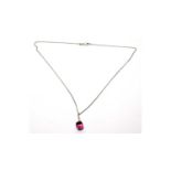 A pink sapphire and diamond pendant,
