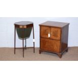 An Edwardian work table; and a mahogany cupboard.