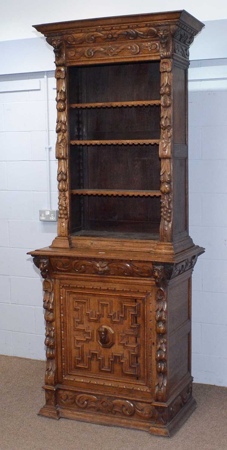 A profusely carved North European 19th C oak bookcase cabinet. - Image 2 of 12