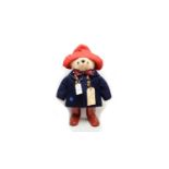 A Paddington stuffed teddy bear.