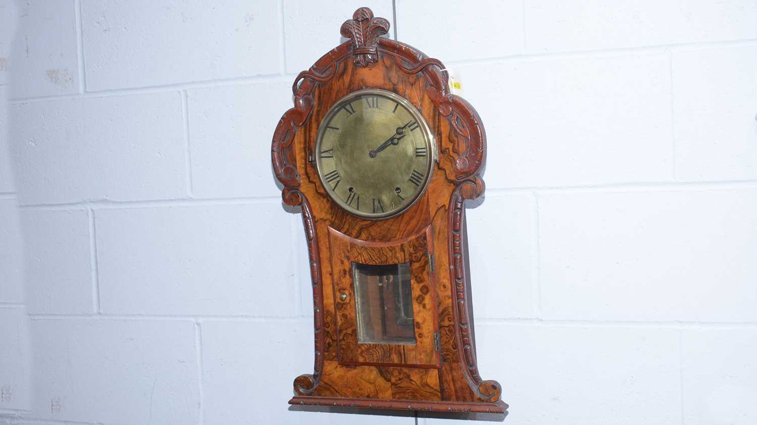 A late 19th Century American burr walnut and oak wall clock.
