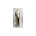 A lady's Crombie cashmere coat | in pale oatmeal and lined in copper satin