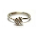 A diamond cluster ring,