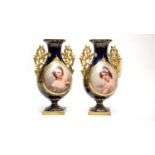 A pair of Royal Vienna style twin handled vases.