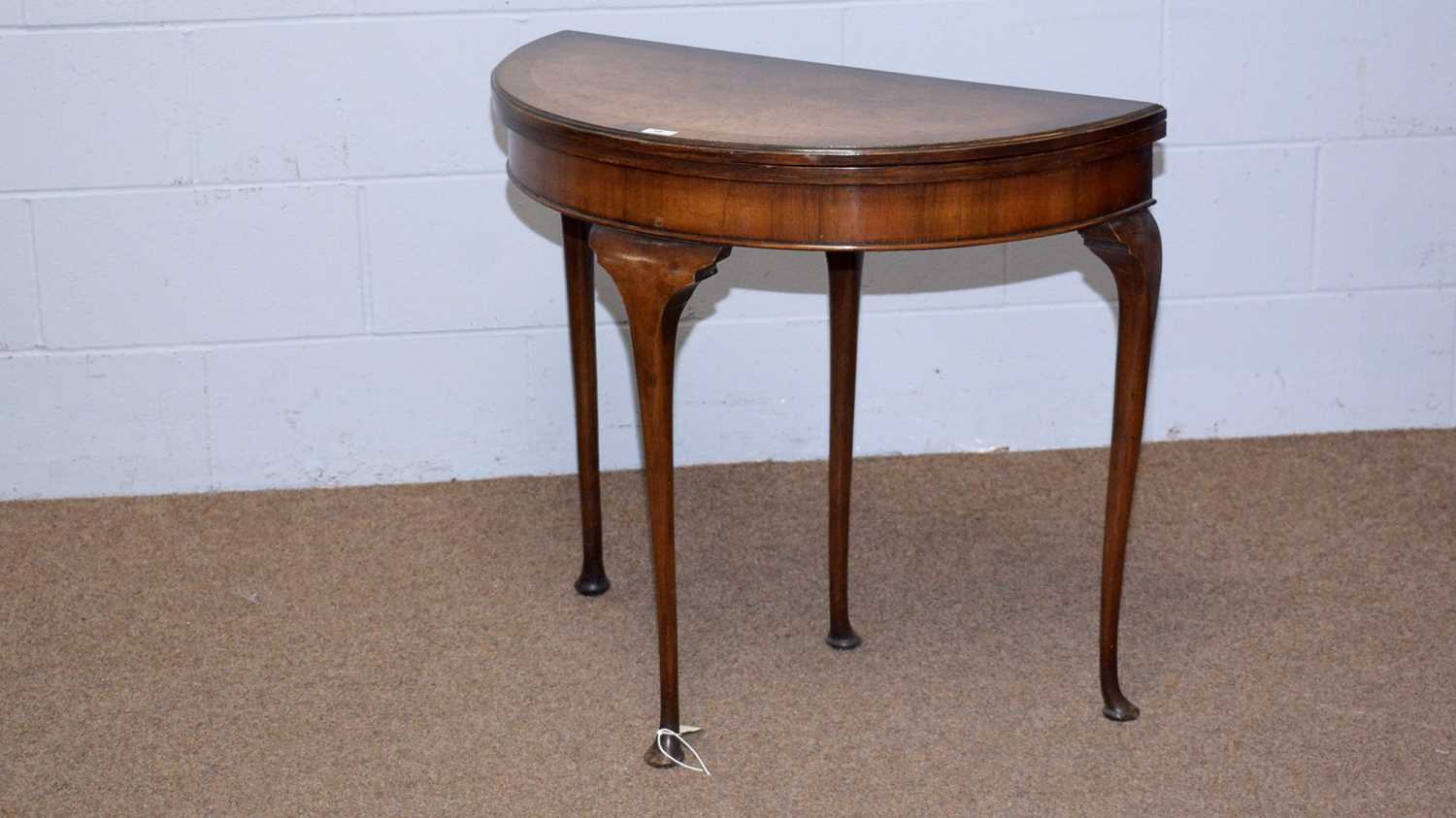 A mid 20th Century burr walnut and banded demilune card table.